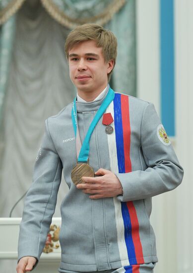 President Vladimir Putin presents state decorations to 2018 Winter Olympics medalists