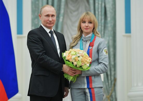 President Vladimir Putin presents state decorations to 2018 Winter Olympics medalists