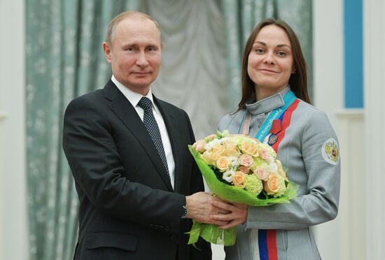 President Vladimir Putin presents state decorations to 2018 Winter Olympics medalists