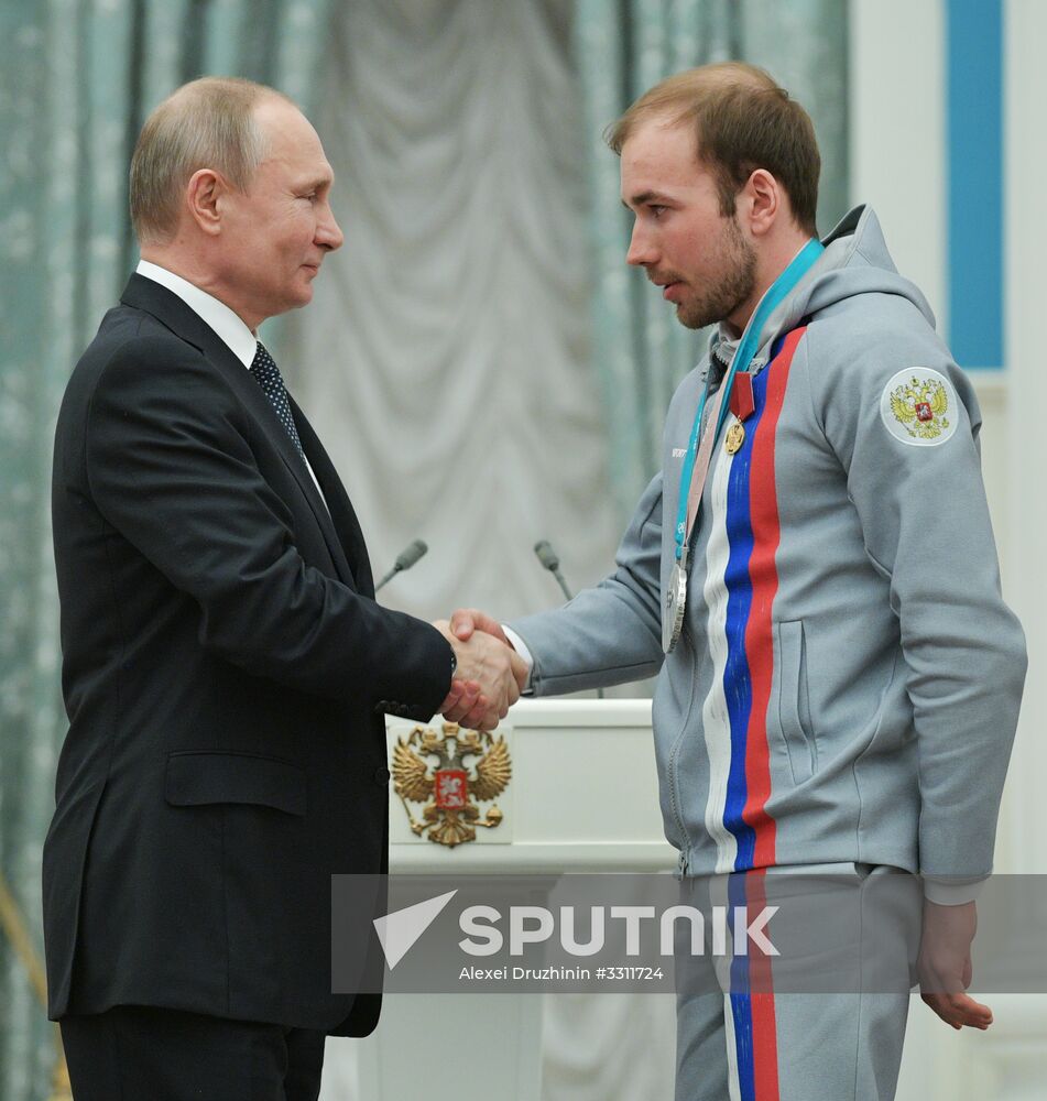 President Vladimir Putin presents state decorations to 2018 Winter Olympics medalists