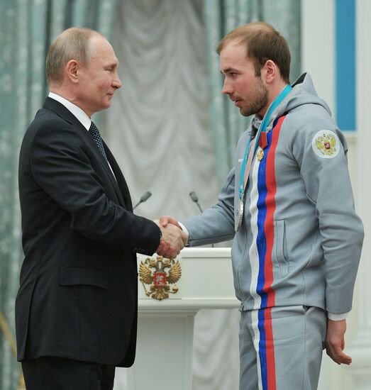 President Vladimir Putin presents state decorations to 2018 Winter Olympics medalists