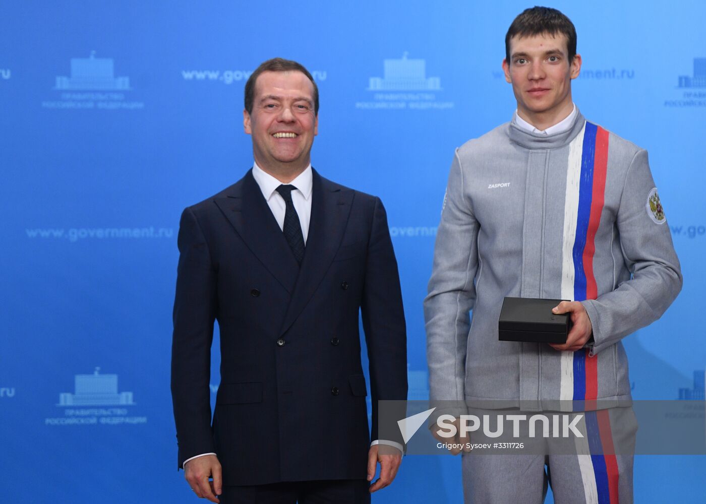 Prime Minister Dmitry Medvedev presents cars to 2018 Winter Olympics medalists at ceremony