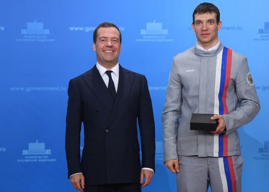 Prime Minister Dmitry Medvedev presents cars to 2018 Winter Olympics medalists at ceremony