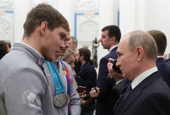 President Vladimir Putin presents state decorations to 2018 Winter Olympics medalists