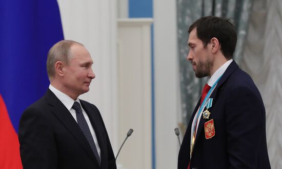 President Vladimir Putin presents state decorations to 2018 Winter Olympics medalists
