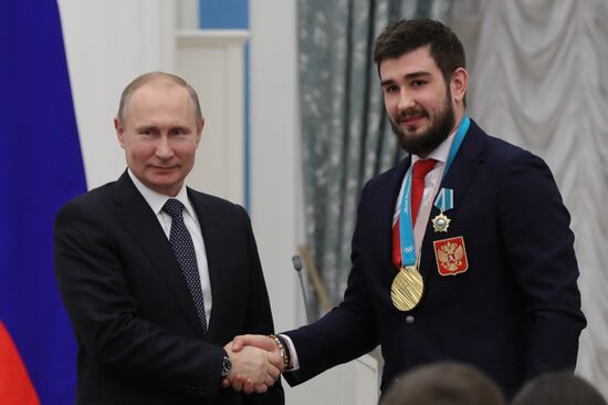 President Vladimir Putin presents state decorations to 2018 Winter Olympics medalists