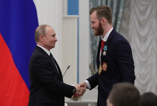 President Vladimir Putin presents state decorations to 2018 Winter Olympics medalists