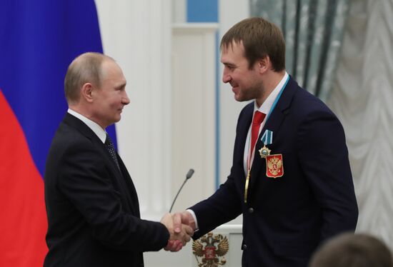 President Vladimir Putin presents state decorations to 2018 Winter Olympics medalists