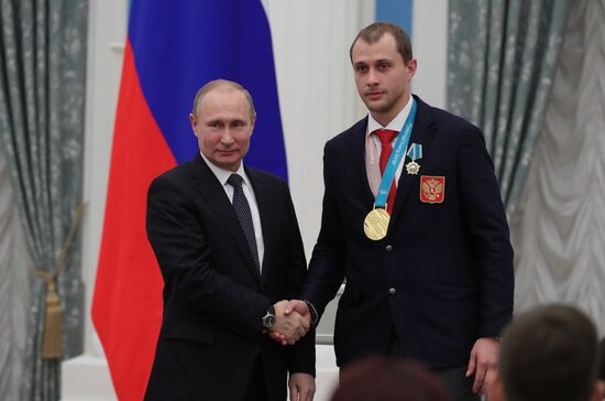 President Vladimir Putin presents state decorations to 2018 Winter Olympics medalists