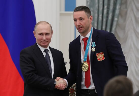 President Vladimir Putin presents state decorations to 2018 Winter Olympics medalists