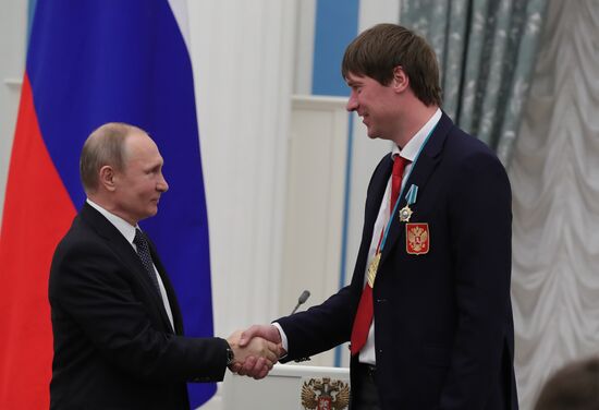 President Vladimir Putin presents state decorations to 2018 Winter Olympics medalists