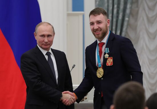 President Vladimir Putin presents state decorations to 2018 Winter Olympics medalists
