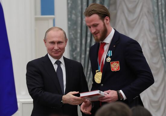 President Vladimir Putin presents state decorations to 2018 Winter Olympics medalists
