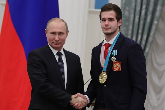 President Vladimir Putin presents state decorations to 2018 Winter Olympics medalists