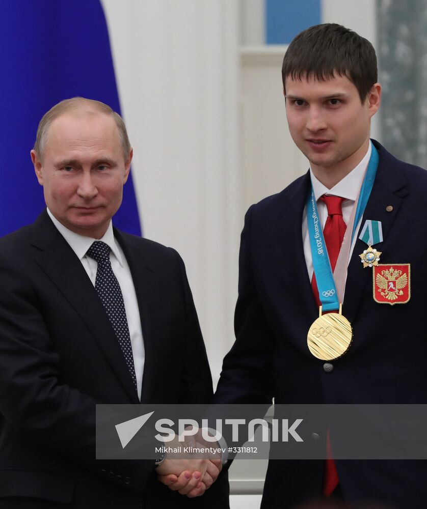 President Vladimir Putin presents state decorations to 2018 Winter Olympics medalists