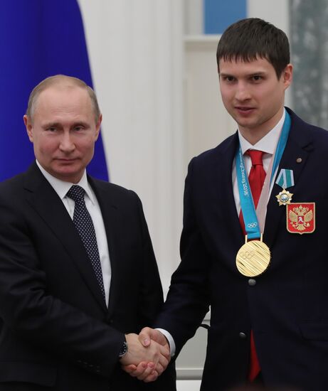 President Vladimir Putin presents state decorations to 2018 Winter Olympics medalists