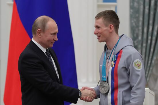 President Vladimir Putin presents state decorations to 2018 Winter Olympics medalists