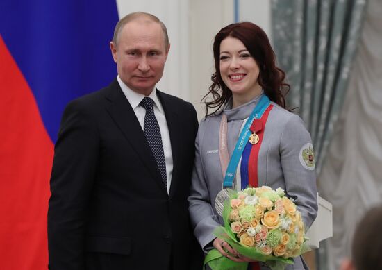 President Vladimir Putin presents state decorations to 2018 Winter Olympics medalists