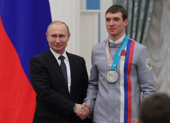 President Vladimir Putin presents state decorations to 2018 Winter Olympics medalists