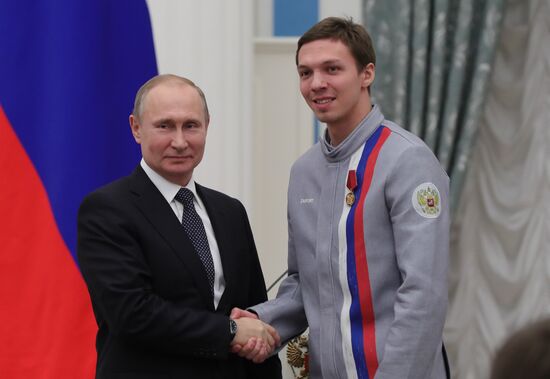 President Vladimir Putin presents state decorations to 2018 Winter Olympics medalists