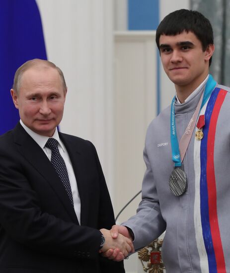 President Vladimir Putin presents state decorations to 2018 Winter Olympics medalists