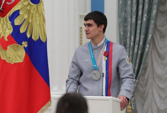 President Vladimir Putin presents state decorations to 2018 Winter Olympics medalists