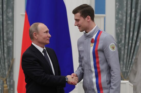 President Vladimir Putin presents state decorations to 2018 Winter Olympics medalists