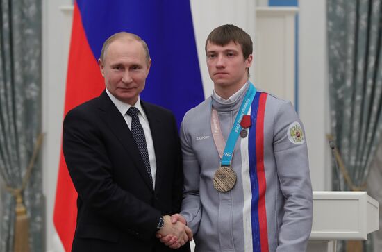 President Vladimir Putin presents state decorations to 2018 Winter Olympics medalists