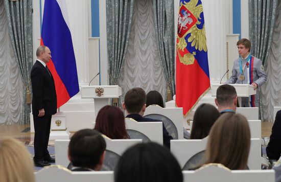 President Vladimir Putin presents state decorations to 2018 Winter Olympics medalists