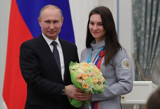 President Vladimir Putin presents state decorations to 2018 Winter Olympics medalists