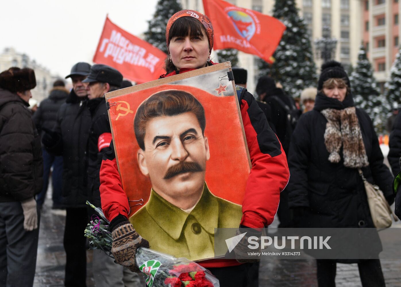 Laying flowers at Stalin's tomb by Kremlin wall