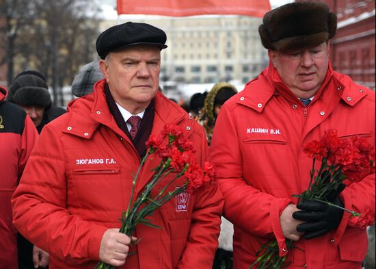 Laying flowers at Stalin's tomb by Kremlin wall