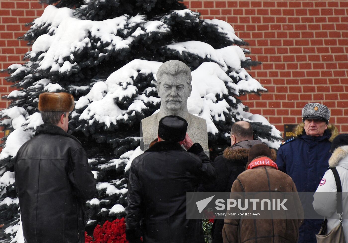 Laying flowers at Stalin's tomb by Kremlin wall