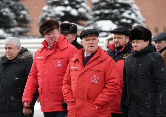 Laying flowers at Stalin's tomb by Kremlin wall