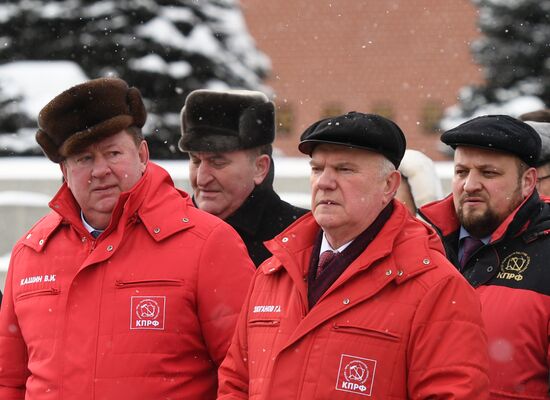 Laying flowers at Stalin's tomb by Kremlin wall