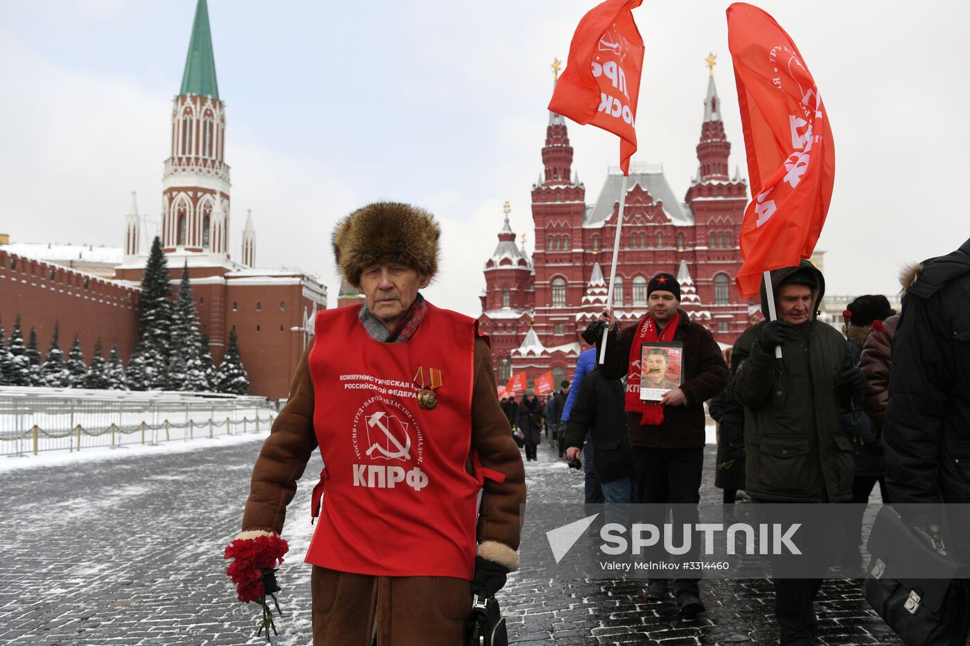 Laying flowers at Stalin's tomb by Kremlin wall