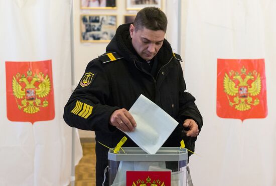Military personnel during early voting for Russian president in Sevastopol