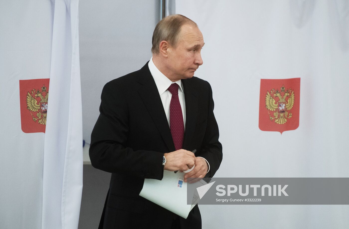 Vladimir Putin votes at Russian presidential elections