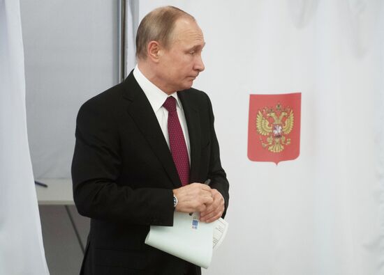 Vladimir Putin votes at Russian presidential elections