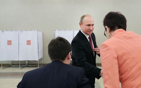 Vladimir Putin votes at Russian presidential elections