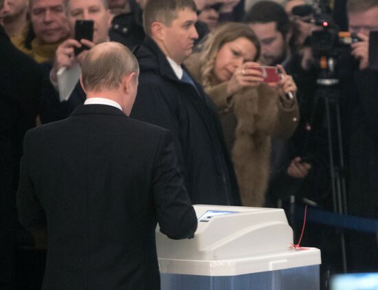 Vladimir Putin votes at Russian presidential elections