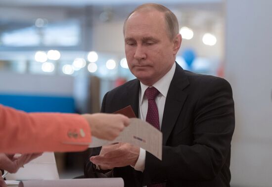 Vladimir Putin votes at Russian presidential elections