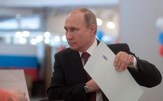 Vladimir Putin votes at Russian presidential elections