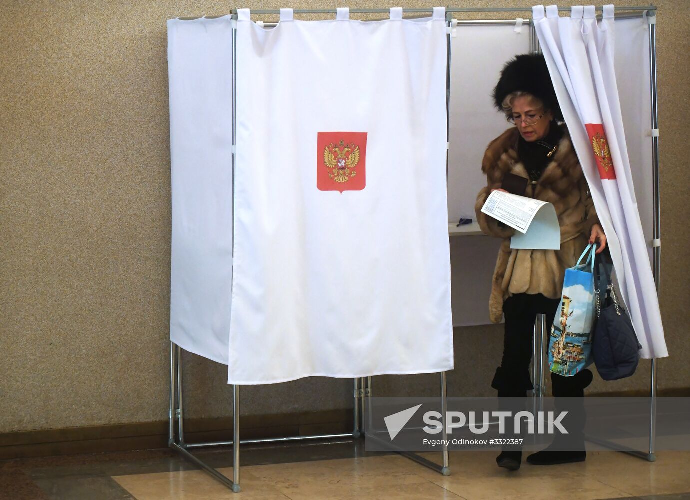 Russian presidential candidates cast their votes
