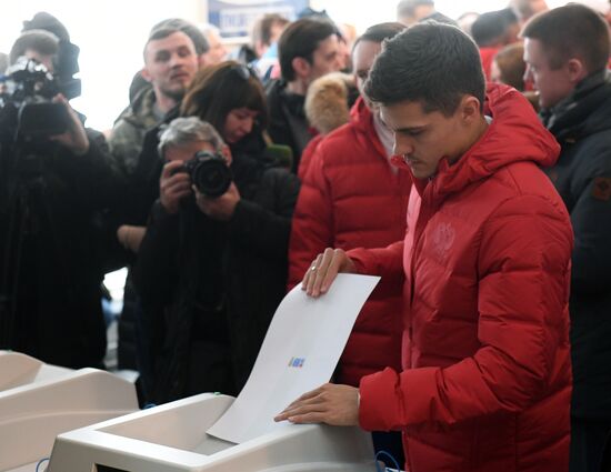 Members of Russian national football team vote at Russian presidential election