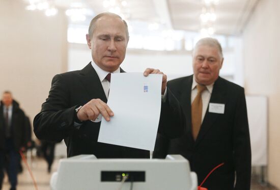 Vladimir Putin votes at Russian presidential elections