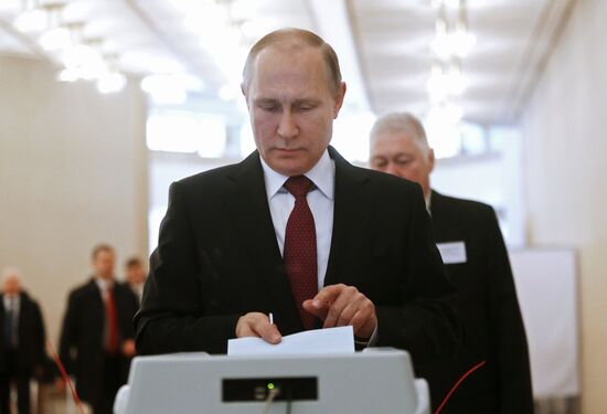Vladimir Putin votes at Russian presidential elections