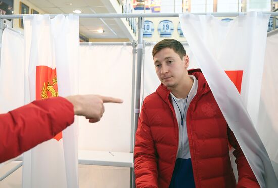 Members of Russian national football team vote at Russian presidential election