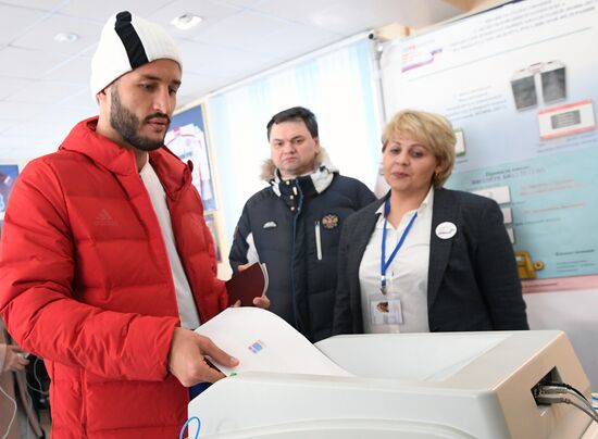 Members of Russian national football team vote at Russian presidential election