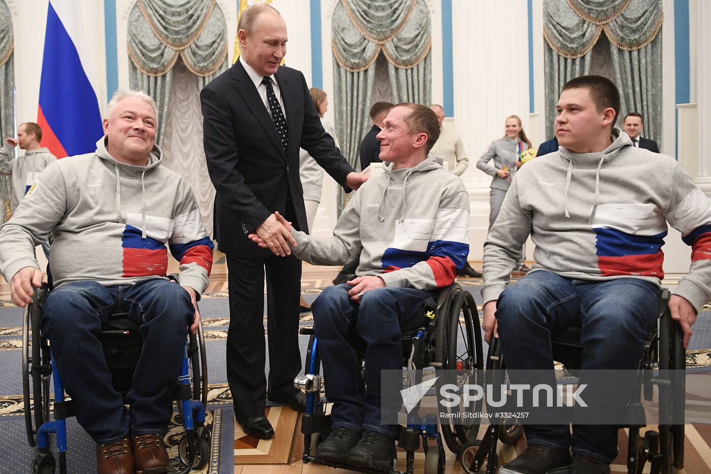 Russian President Vladimir Putin meets with Russian athletes - winners and medalists of 12th Paralympic Winter Games